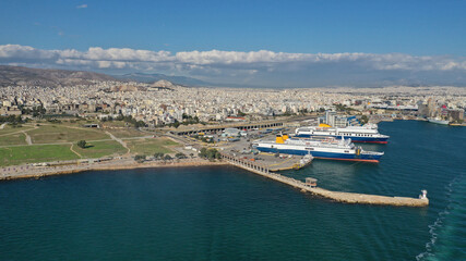 Fototapeta na wymiar Aerial drone photo of famous and busy port of Piraeus where passenger ferries travel to Aegean destination islands as seen from high altitude, Attica, Greece