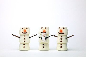 A Happy Smiling Marshmallow Snowman Baby Chilling With Family
