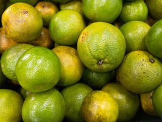 Fruits and vegetables background.  Healthy Living: Elevate Your Well-being with Nutritious Habits!  Close-up of oranges in a supermarket.