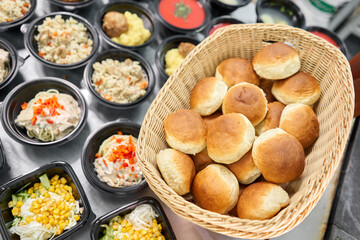 Food delivery. Different in plastic disposable lunch box with healthy natural food. Chicken broth, mashed soup, mashed potatoes with cutlet, seafood pasta, salads, pilaf with a fresh bun.