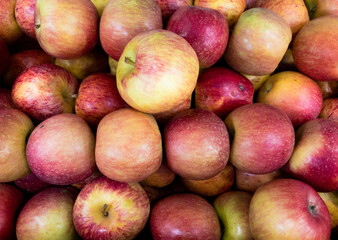 Fruits and vegetables background.  Healthy Living: Elevate Your Well-being with Nutritious Habits!  Close-up of apples in a supermarket.