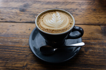 Cappucinno served on a wooden table