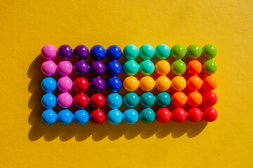 bright multi-colored puzzle pieces are assembled in the form of a rectangle