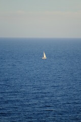 Fototapeta premium A white sailing boat in front of Monaco. the 23rd October 2021.