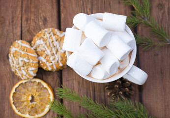 sweet hot cocoa with marshmallows, winter christmas drink on wooden background.
