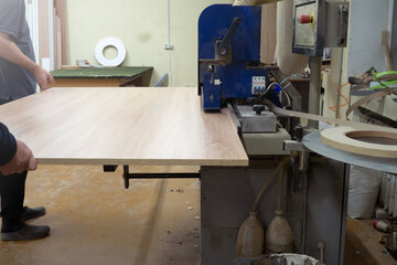 process of sawing wood with a circular saw. Machine for wood cutting MDF and particle Board or chipboard for the manufacture of details of furniture.