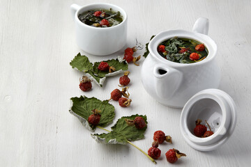 Warming medicinal herbal tea with rose hips and currant leaves