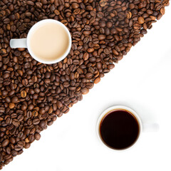Ying and Yang concept through coffee. Two cups of coffee. One has espresso, the other has milk and coffee. Roasted coffee beans on a white background.