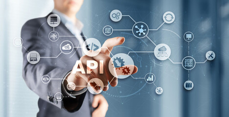 Application Programming Interface. API software development tool. Information technology concept. Businessman presses API text icon on a virtual interface