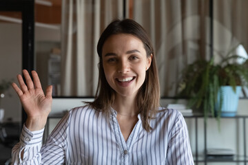 Welcome on business channel. Screen portrait of smiling female presenter speaker expert wave hand...