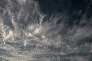 Incredible pattern in the sky. Beautiful clouds in the blue sky. Cirrus clouds. Heaven. Natural background.