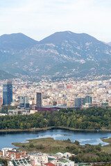 Fototapeta na wymiar Tirana panoramic city view from hills, lake and mountain landscape