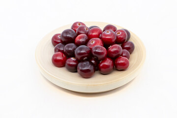 Cranberries on a plate isolate on a white background