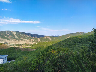 Fototapeta na wymiar Mountain landscape with green summer forests. Green moutain forests landscape. Caucasus mountains.