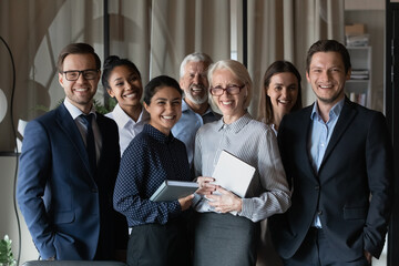 Human resource. Group portrait of smiling employees friendly team of diverse age race gender...