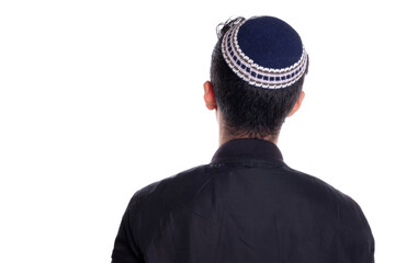 Man wearing kipa seen from the back, white background. religious person seen from behind.