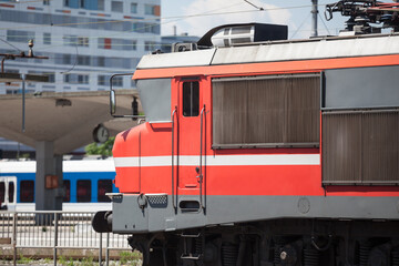 Red electric locomotive of Slovenian Railways shunting on Ljubljana train station platform getting ready for departure. it is the main hub of slovenian railroad...