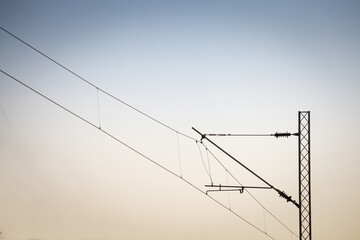 Catenary power overhead line of a railroad track, supplying electricity for trains, with a pylon...
