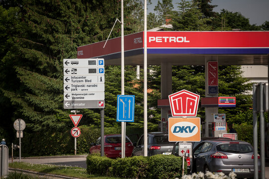 LJUBLJANA, SLOVENIA - JUNE 12, 2021: DKV and UTA logo in front of a slovenian gas station. DKV Mobility and UTA Union Tank Eckstein are German fuel card and payment systems from Europe. ..