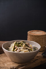 Northeastern Thai food, Spicy bamboo shoot soup with pork and vegetables eating with sticky rice, Local Thai food