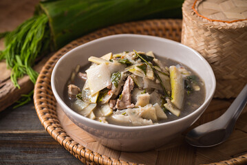 Northeastern Thai food, Spicy bamboo shoot soup with pork and vegetables eating with sticky rice, Local Thai food