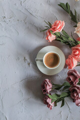 Coffee cup with rose flower on white table background. Valentine day with place for text. Vintage photo. Space for text