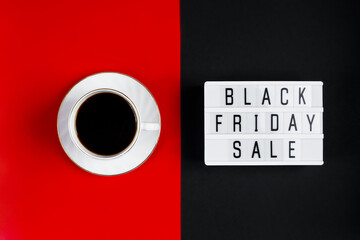 Black Friday sale concept. Cup of coffee on red background. Banner for advertising.