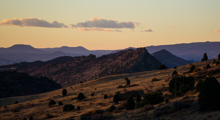 Mountains at sunrise with hazy clouds