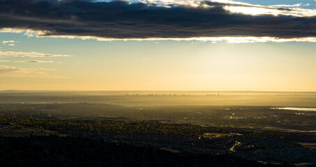 Denver at sunrise, clouds and haze