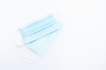 Top view medical mask isolated on white background with copy space. Concept wearing medical mask for protection virus, and distance.