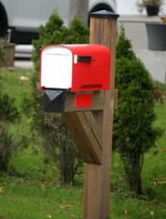 Red and white mailbox in rural countryside