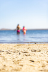 parent and child on beach