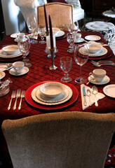 Dinning room table set with an array of fine china