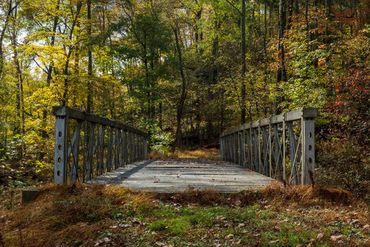 Old Rural Wooden Bridge in Autumn Forest in Ohio