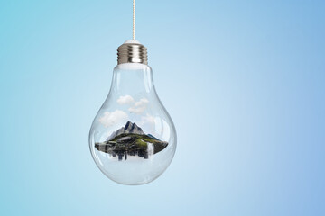 Mountain inside light bulb . Mixed media