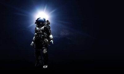 Fototapeta na wymiar Astronaut in suit against black background. Space technology concept