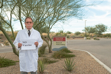 Doctor holds No Vaccine sign in opposition to the mandate in Arizona and United States