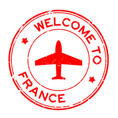 Grunge red welcome to France word with airplane icon round rubber seal stamp on white background