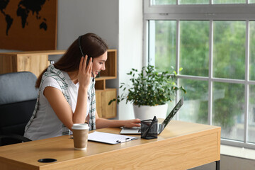 Technical support agent working in office