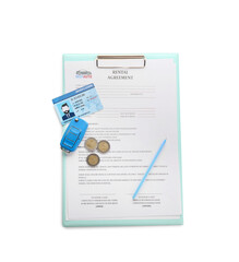 Clipboard with rental agreement, driver license, coins and pen on white background