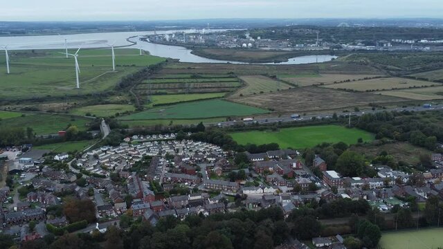 Aerial view above Halton North England Runcorn Cheshire motorway and countryside wind turbines industry landscape