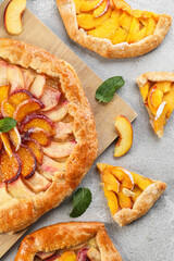 Composition with tasty peach galette on light background