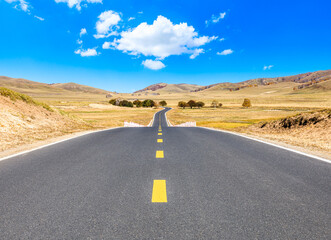 Empty asphalt road and mountain nature landscape under blue sky.