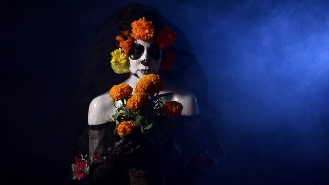 Young woman with halloween costume on  black background, woman with catrina custome