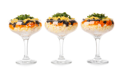 Delicious layered salad with prunes in glasses on white background