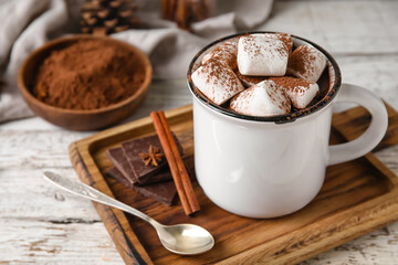 Mug of tasty hot chocolate on wooden background