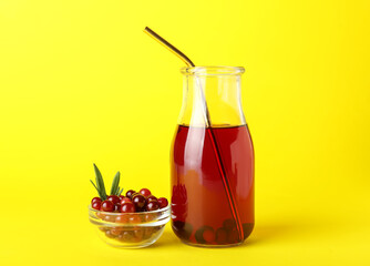 Bottle with healthy cranberry juice on color background