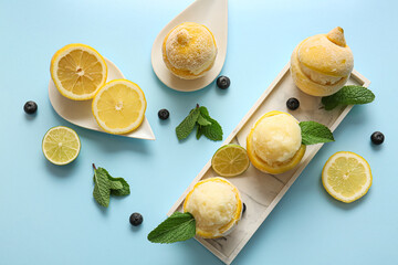 Plate with tasty ice creams in lemon peels on color background - obrazy, fototapety, plakaty