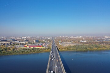 Obraz premium Transport bridge across the river. Nizhny Novgorod, Myzinsky bridge. Aerial photography of the river, and the bridge over the river from a drone.
