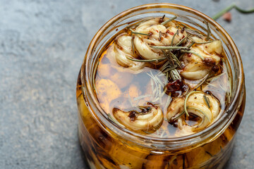 Jar of cheese pieces with herbs and spices in olive oil. banner, menu, recipe place for text, top...